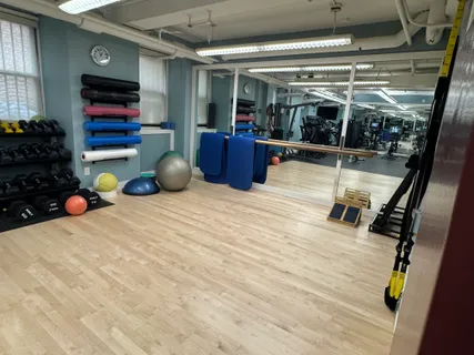 a room with gym equipment and a window