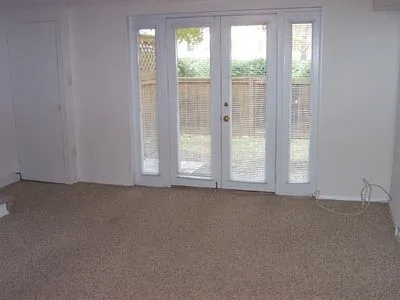 a view of an empty room with a window