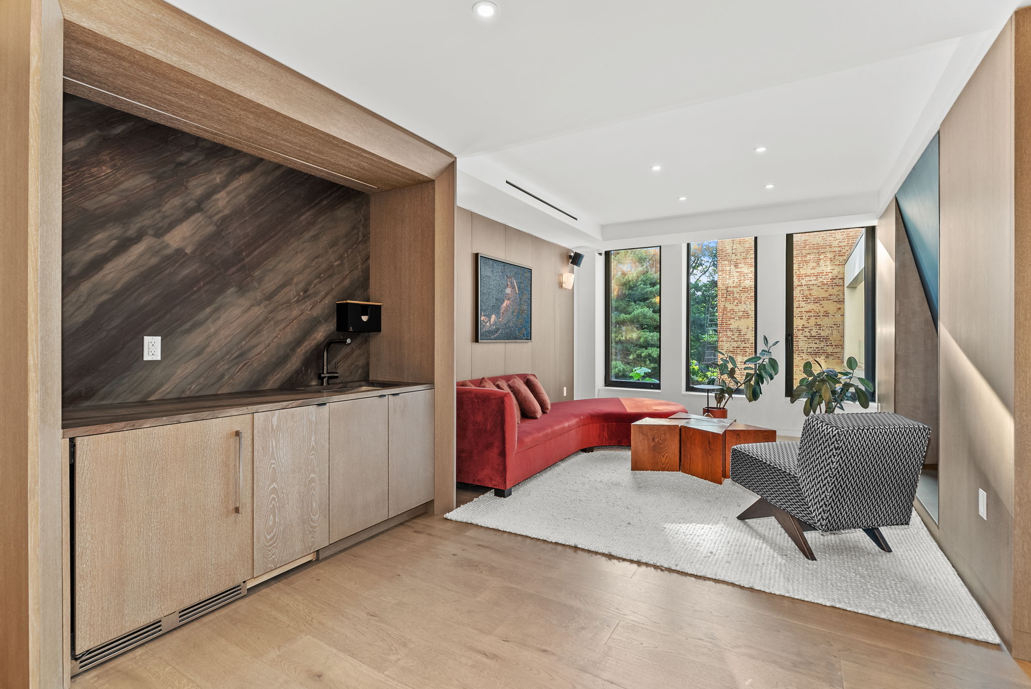 58 St Marks Place, Unit 206 Brooklyn, NY 11217 - Photo 10 of 27 a living room with furniture and a large window