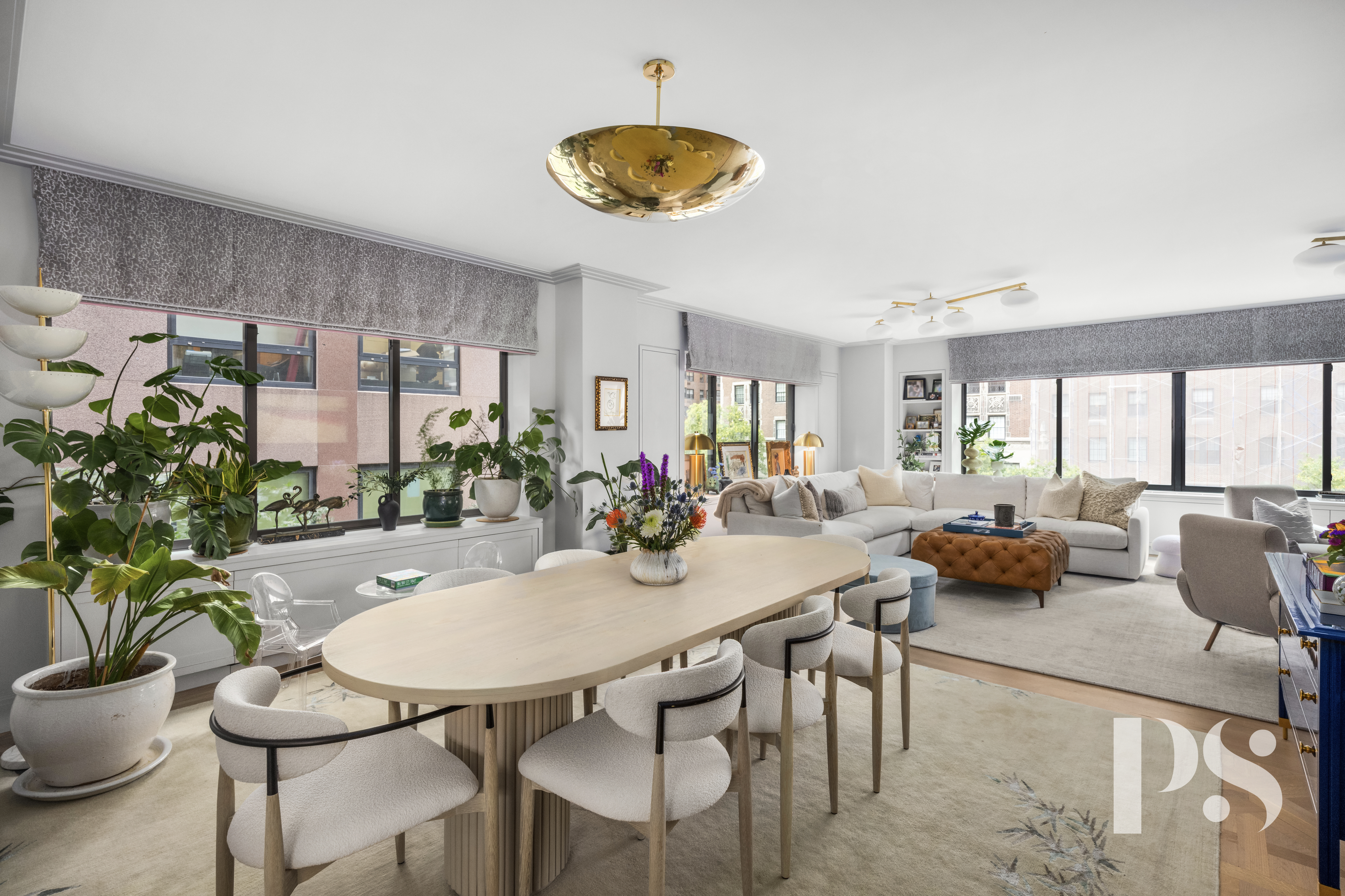 733 Park Avenue, Unit 4 Manhattan, NY 10021 - Photo 6 of 29 a view of a dining room with furniture and a potted plant