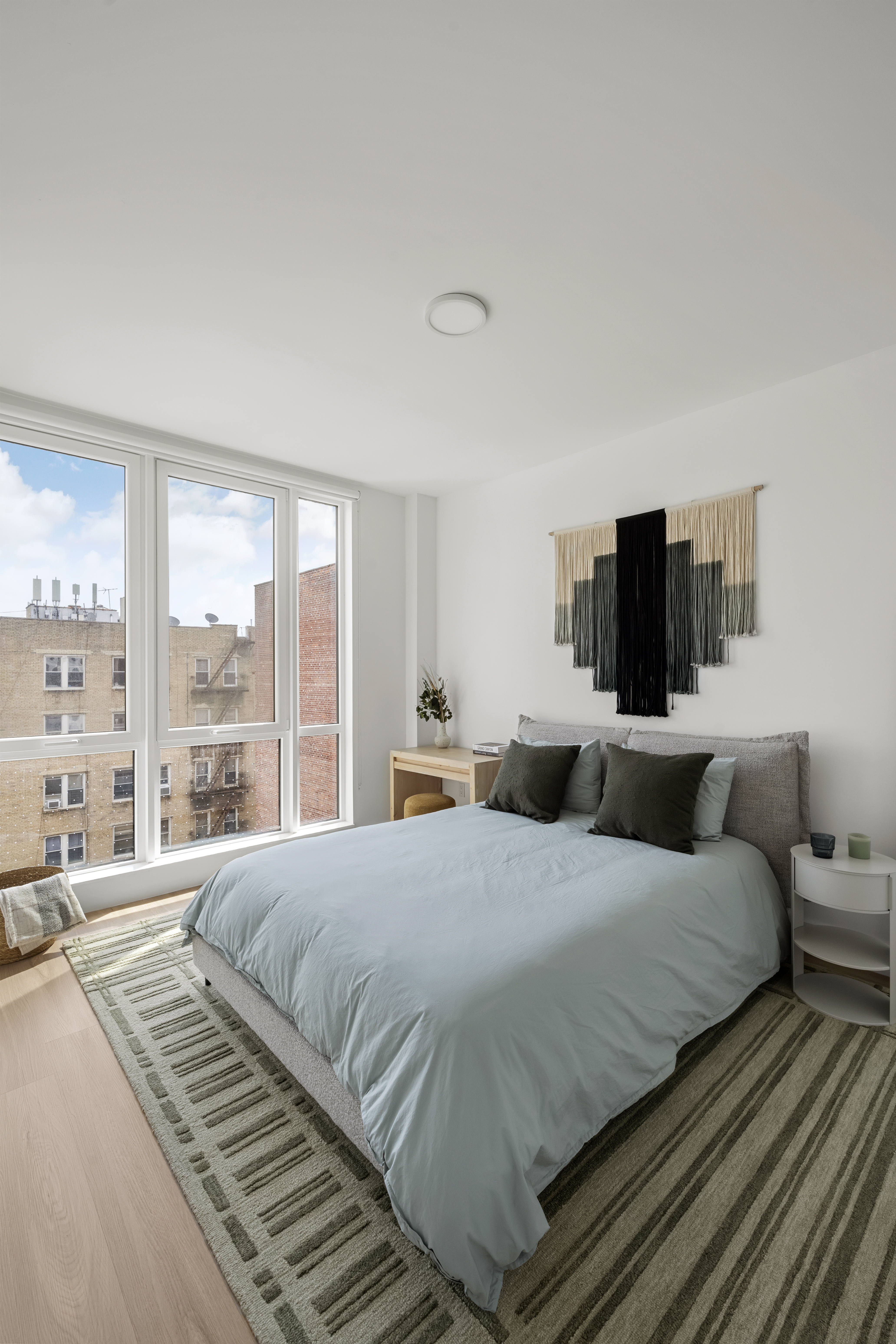340 Lenox Road, Unit 6D Brooklyn, NY 11226 - Photo 7 of 29 a bedroom with a bed and large window