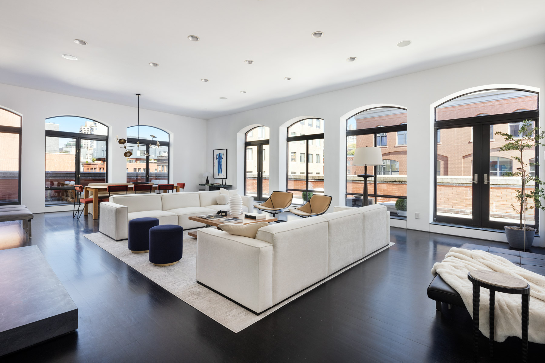 92 Laight Street, Unit PHC Manhattan, NY 10013 - Photo 3 of 16 a living room with furniture and a large window