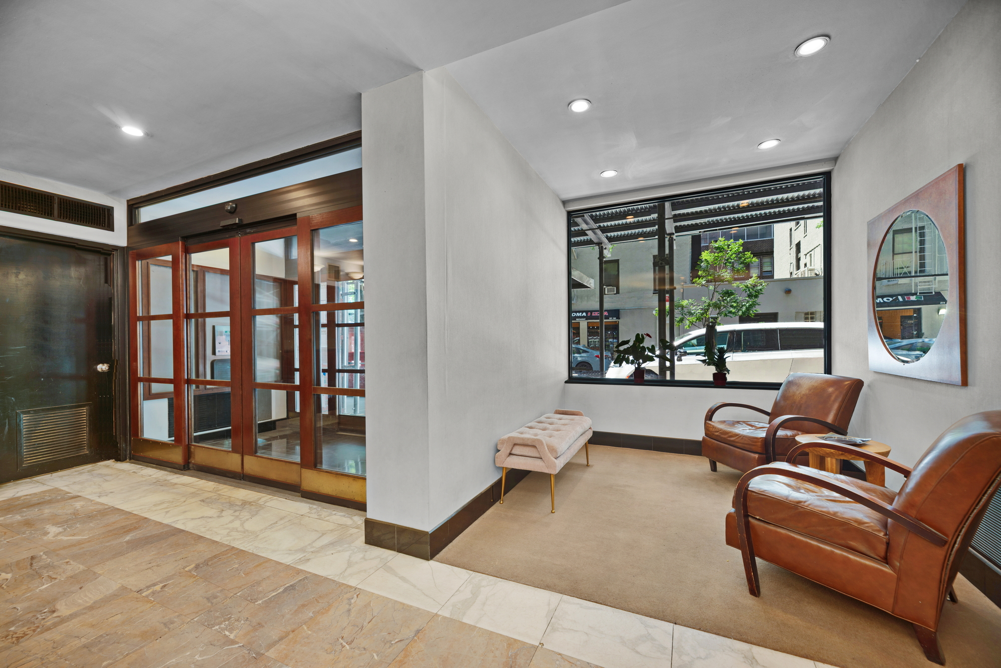 245 East 24th Street, Unit 10E Manhattan, NY 10010 - Photo 9 of 12 a living room with furniture and a large window