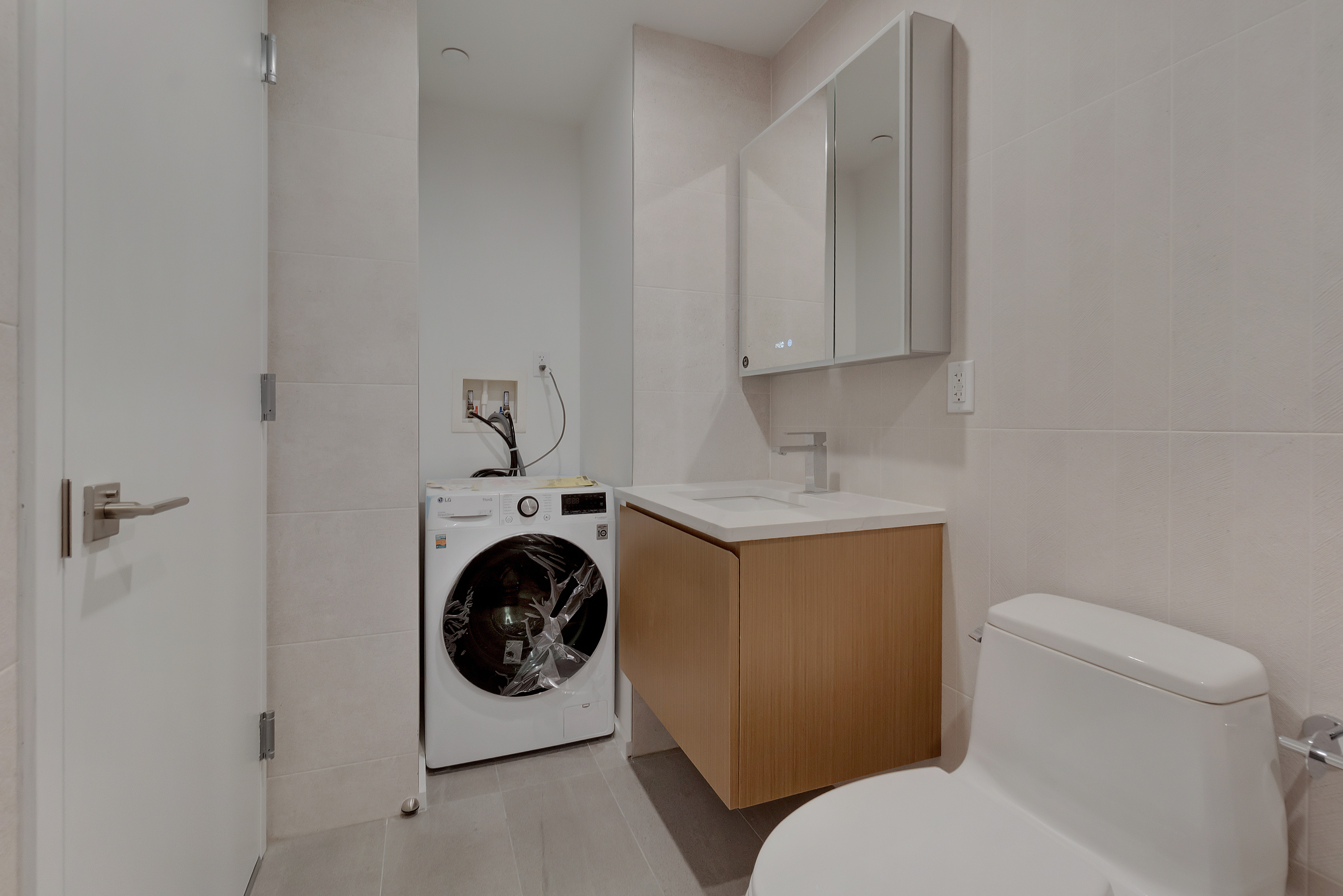 2286 Cropsey Avenue, Unit 6G Brooklyn, NY 11214 - Photo 11 of 22 a bathroom with a toilet sink and vanity