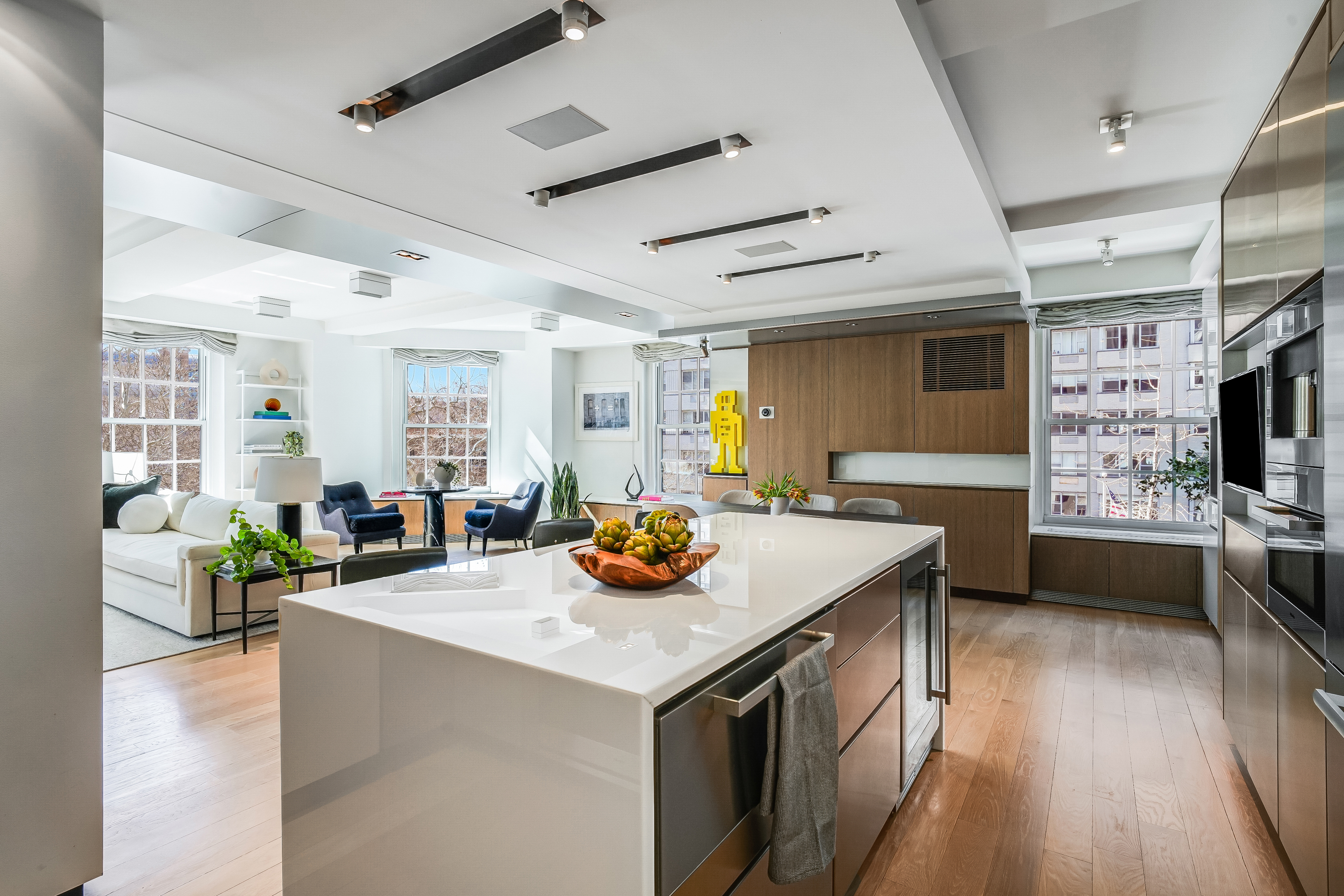1 5th Avenue, Unit 5GH Manhattan, NY 10003 - Photo 5 of 26 a open kitchen with stainless steel appliances granite countertop a stove and a view of living room