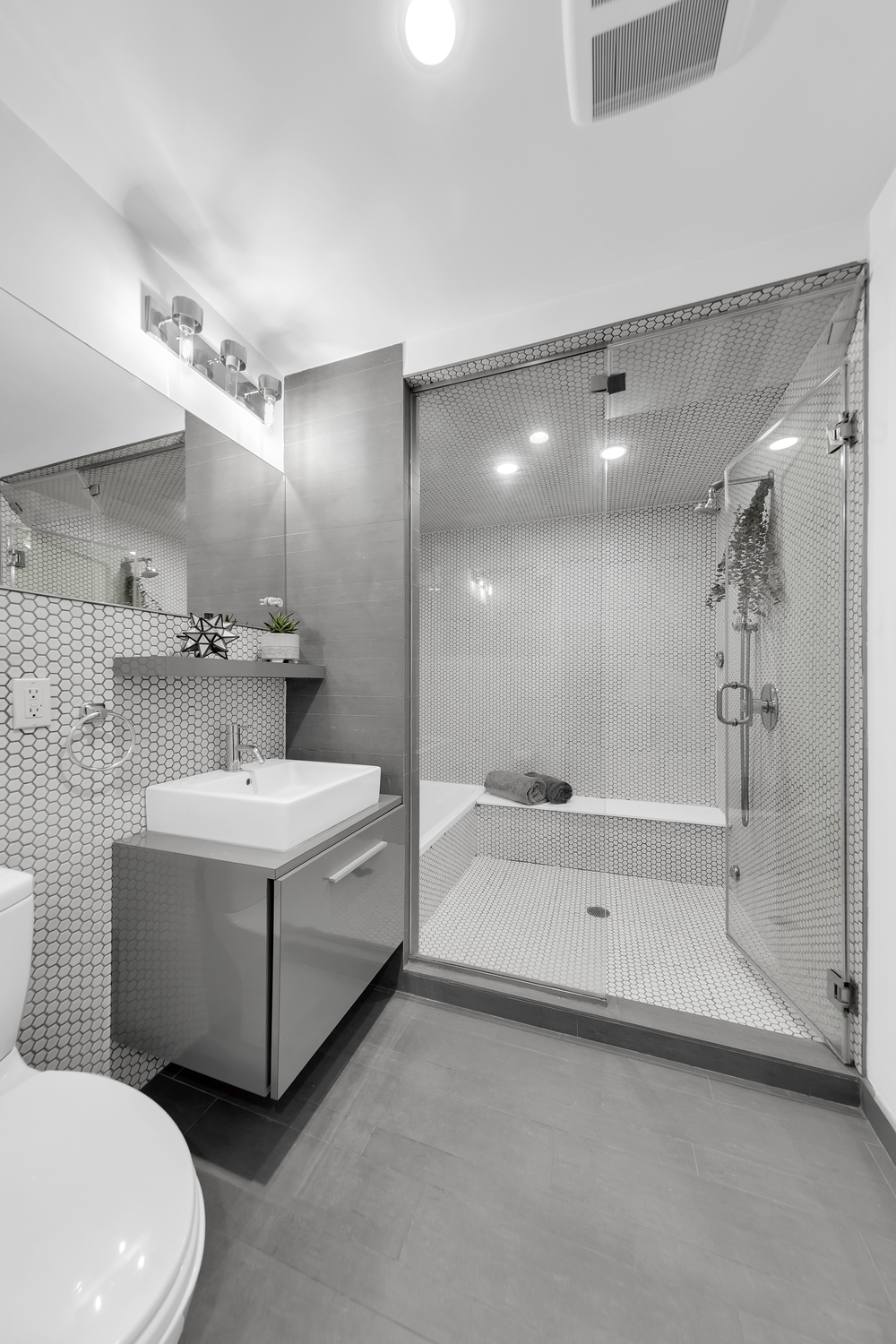 29 Montrose Avenue, Unit 4B Brooklyn, NY 11206 - Photo 5 of 6 a bathroom with a sink a toilet and shower