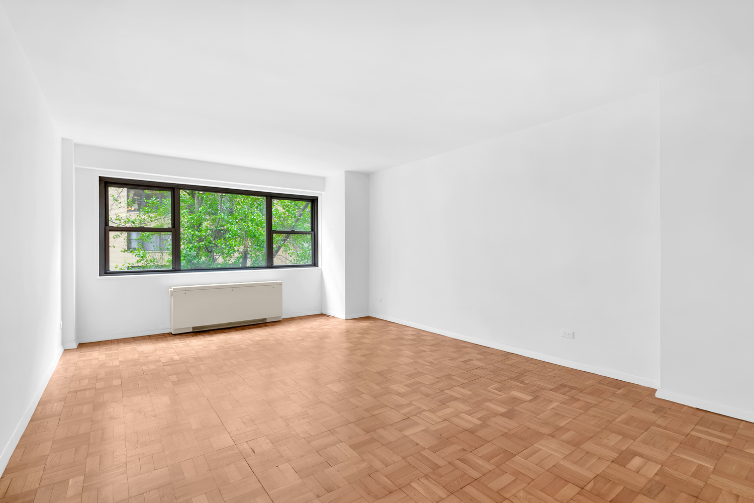 330 East 49th Street, Unit 3E Manhattan, NY 10017 - Photo 1 of 5 a view of an empty room with a window