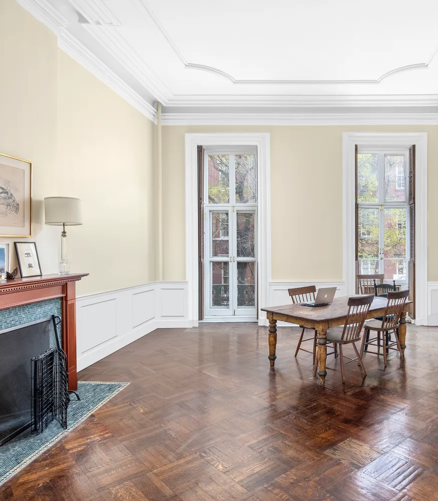 a dining room with furniture and wooden floor