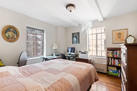 a bedroom with a bed furniture and a window
