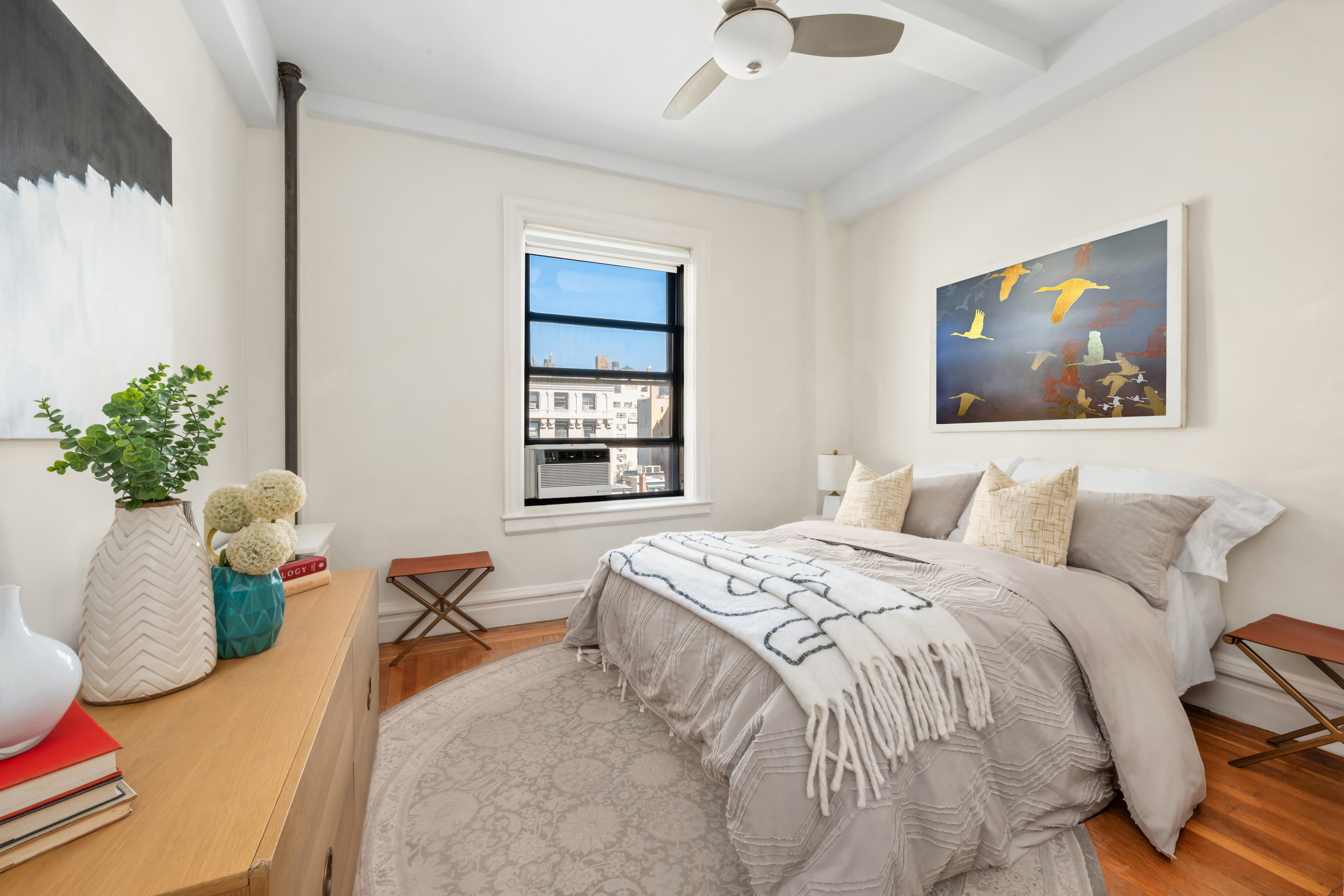 35 West 82nd Street, Unit 8C Manhattan, NY 10024 - Photo 6 of 10 a bedroom with a bed and a painting on the wall