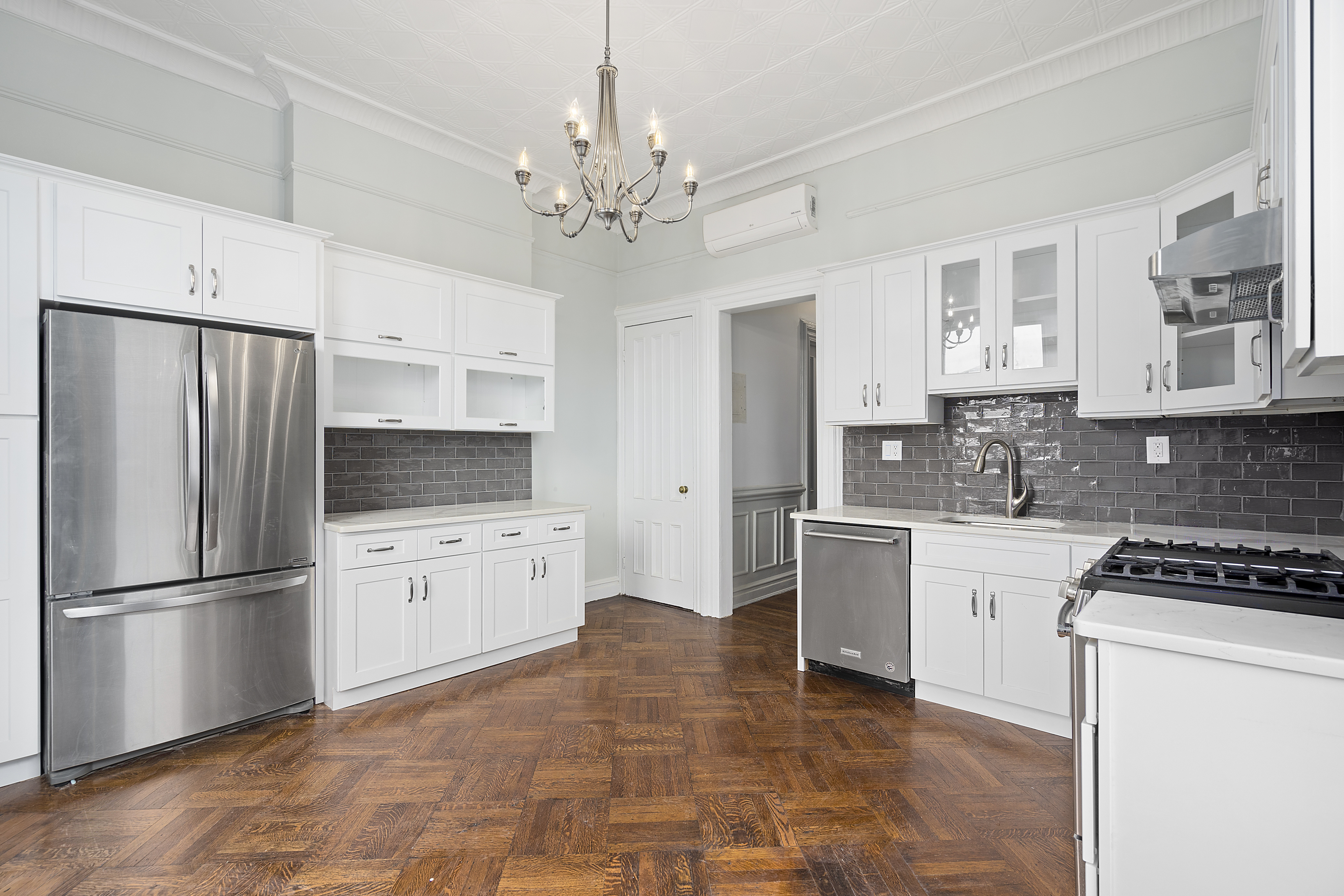419 Clinton Avenue Brooklyn, NY 11238 - Photo 11 of 19 a kitchen with granite countertop stainless steel appliances a refrigerator stove top oven and sink