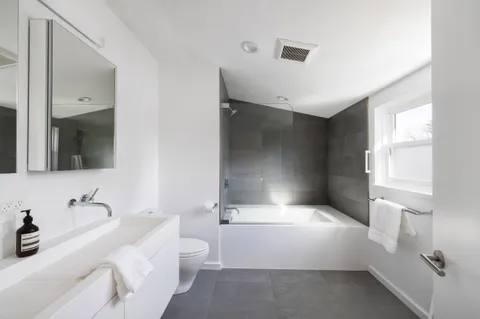 a bathroom with a bathtub and a sink
