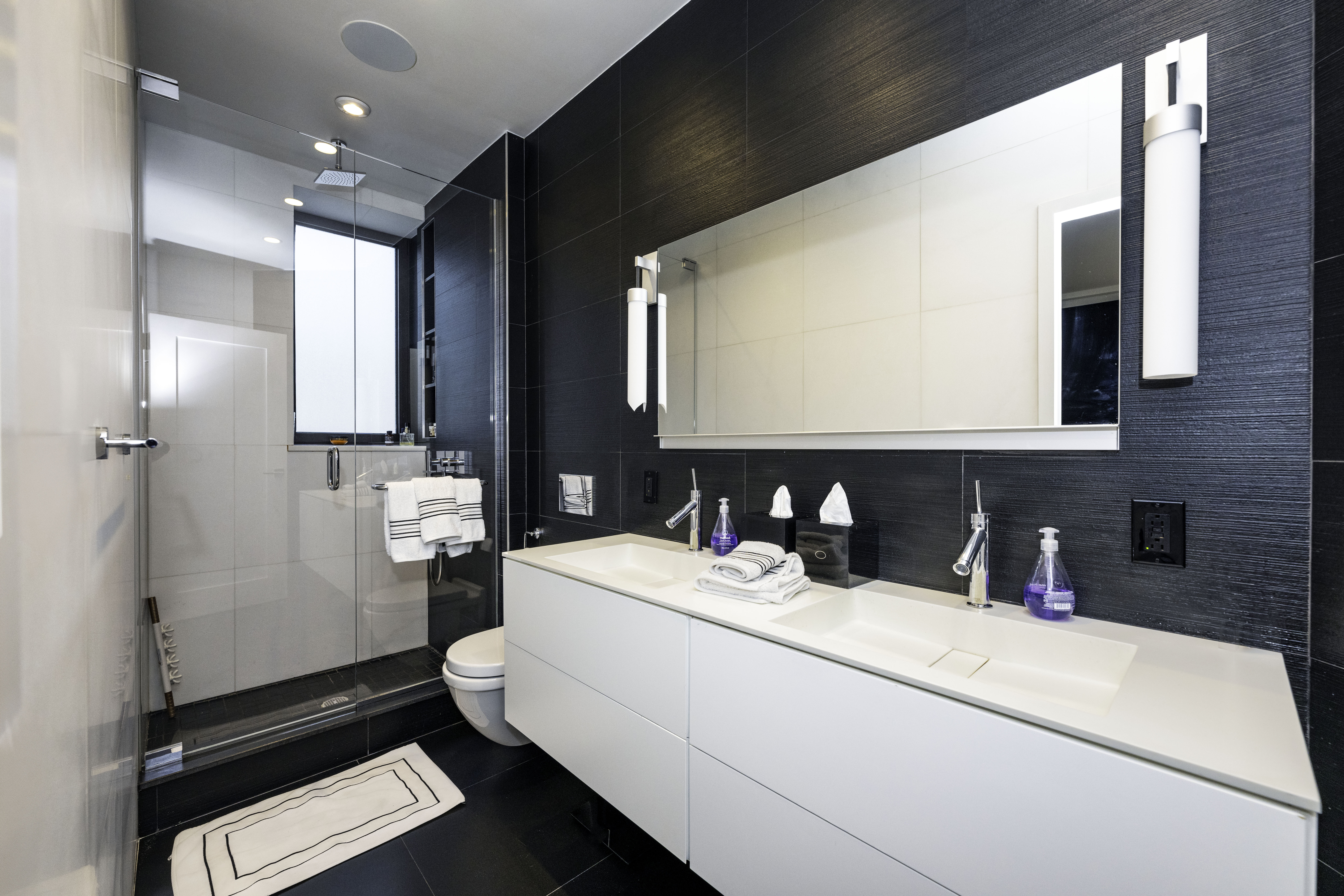 40 East 62nd Street, Unit 8E Manhattan, NY 10065 - Photo 16 of 24 a bathroom with a sink and a mirror
