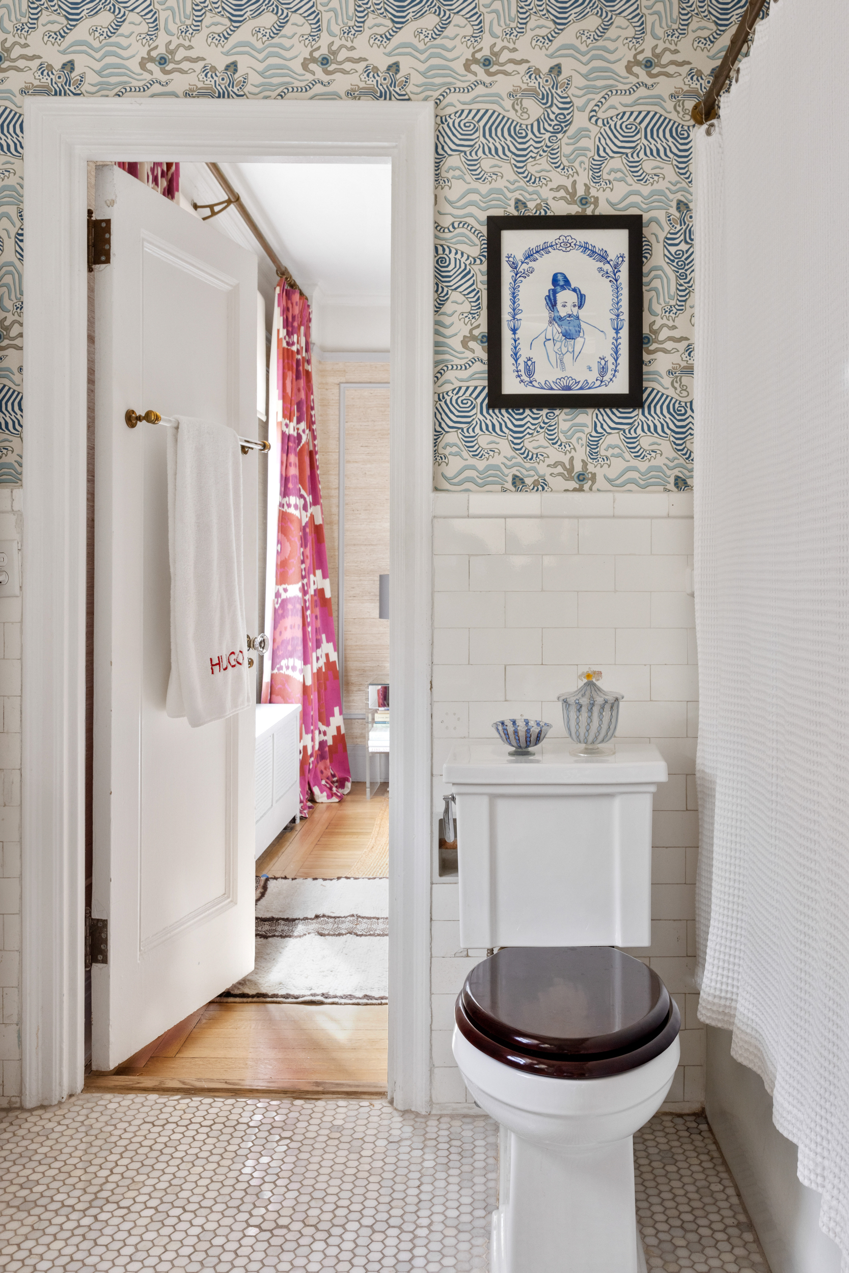 38 East 85th Street, Unit 10E Manhattan, NY 10028 - Photo 7 of 14 a living room with a painting on the wall and a wooden floor