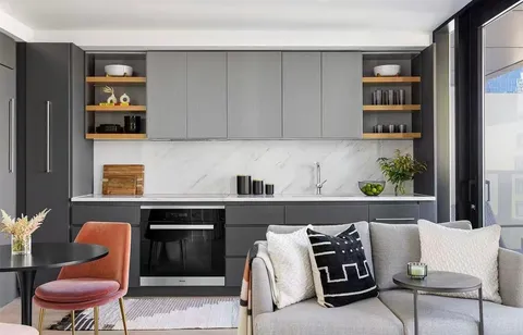 a living room with furniture and a painting