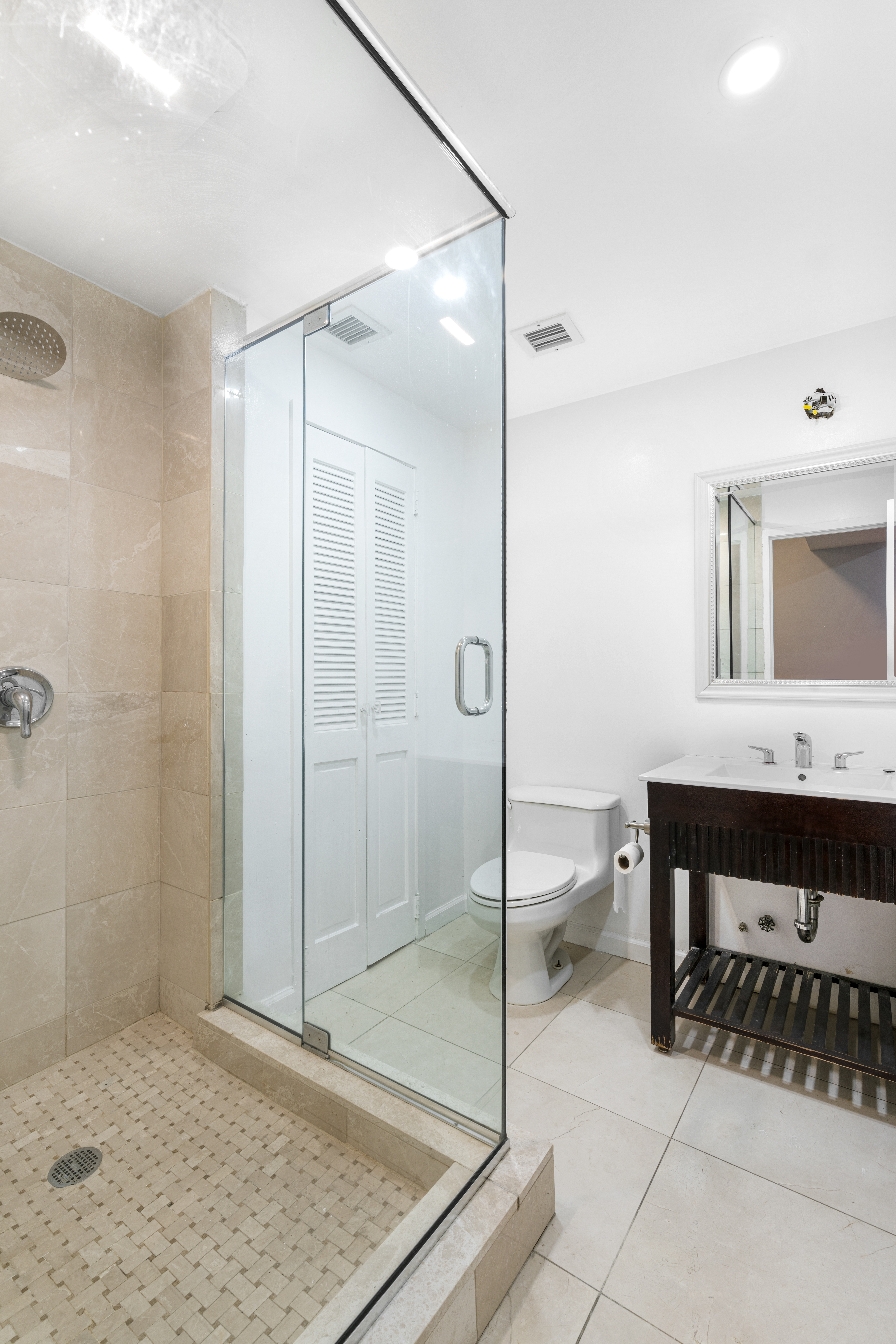 152 East 74th Street, Unit 2 Manhattan, NY 10021 - Photo 13 of 16 a bathroom with a sink and a mirror