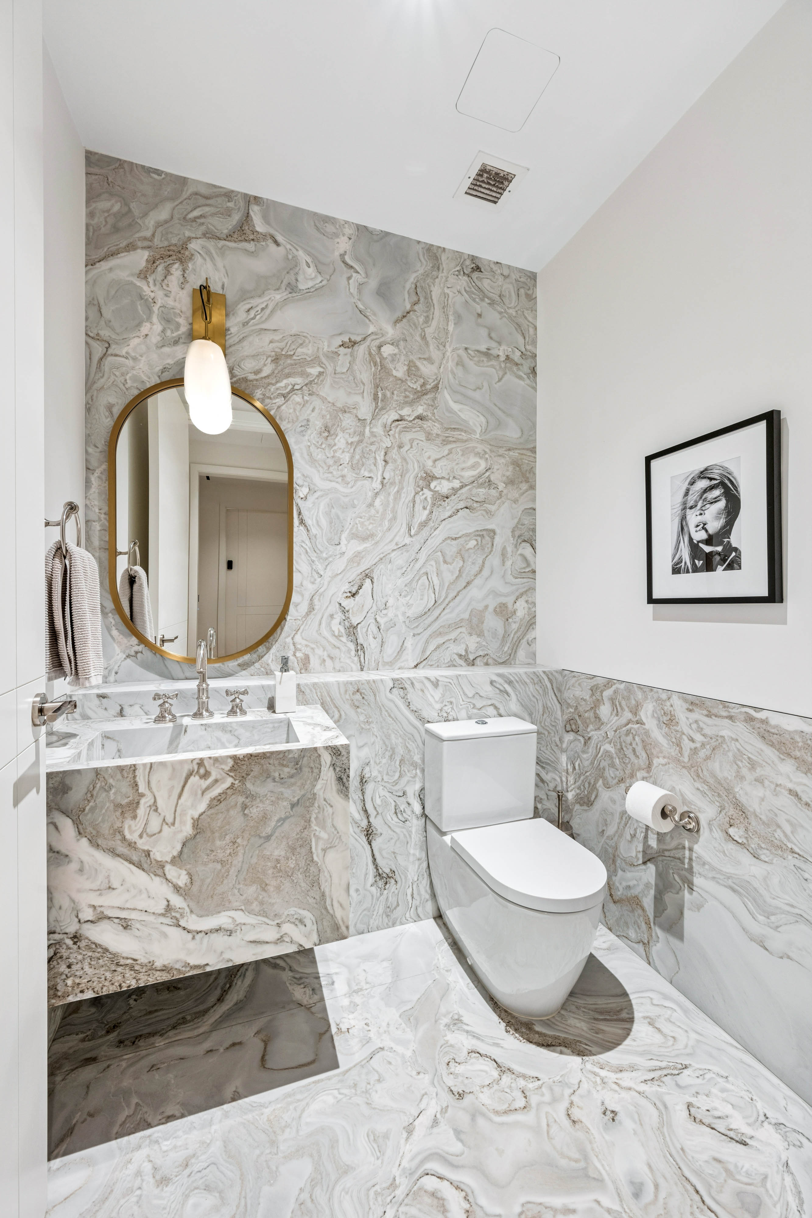 1228 Madison Avenue, Unit 11 Manhattan, NY 10128 - Photo 19 of 22 a bathroom with a toilet sink and mirror