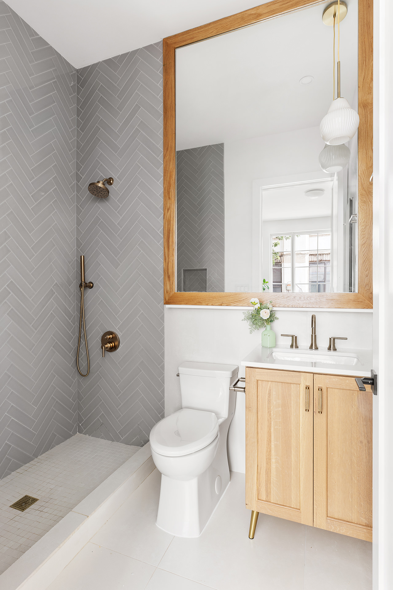 262 17th Street, Unit PH Brooklyn, NY 11215 - Photo 8 of 15 a bathroom with a sink a toilet and shower