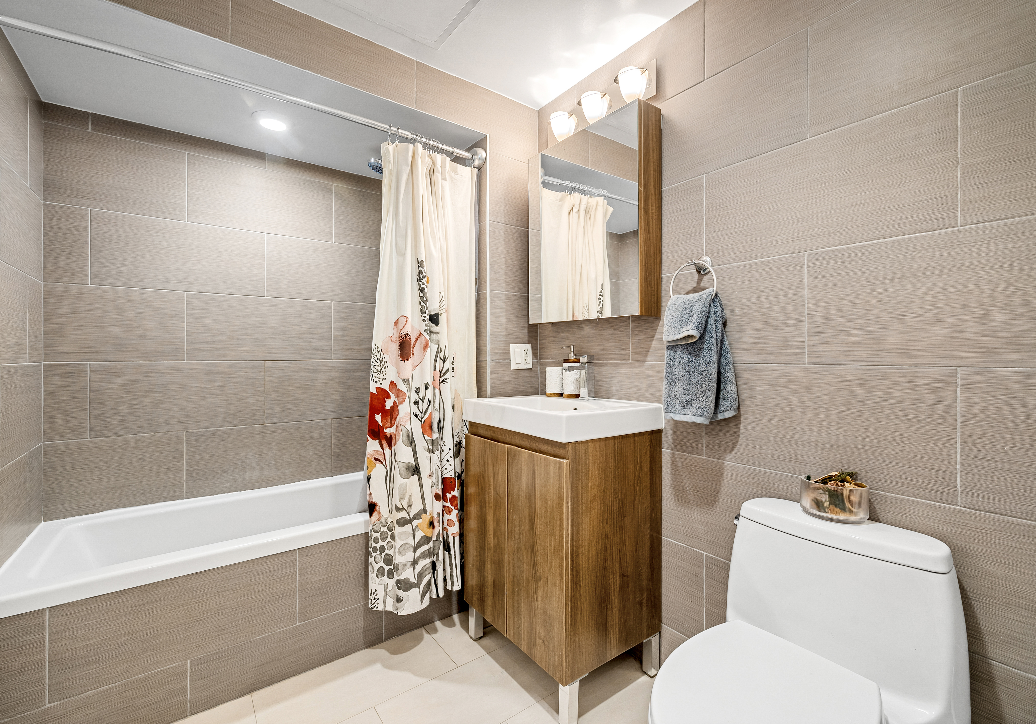 307 Cooper Street, Unit 3B Brooklyn, NY 11237 - Photo 8 of 10 a bathroom with a sink toilet and shower