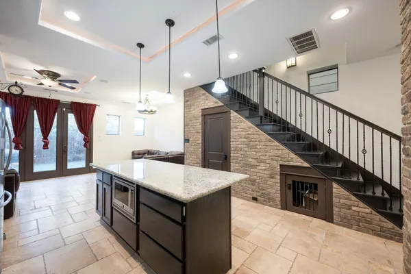a kitchen that has a lot of cabinets in it