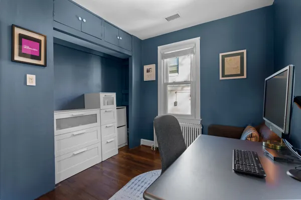 a livingroom with window and a couch