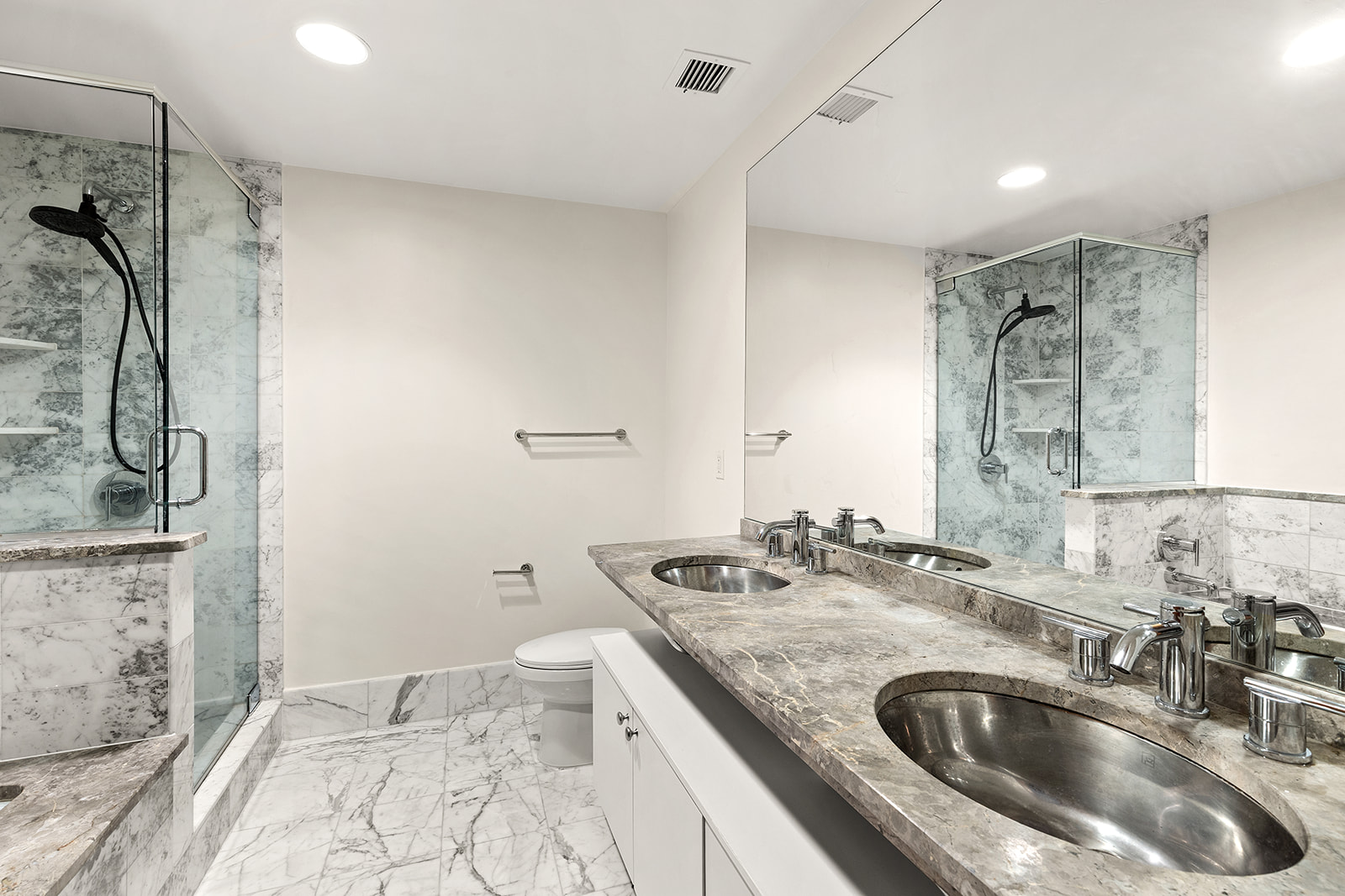 446 Kent Avenue, Unit PHC Brooklyn, NY 11249 - Photo 9 of 22 a bathroom with a granite countertop sink a mirror and shower