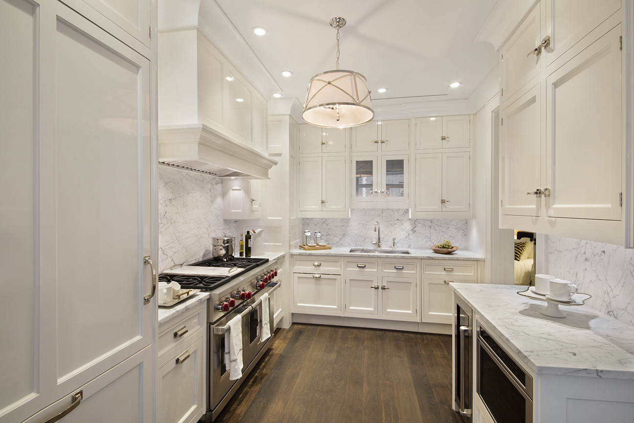 1110 Park Avenue, Unit C Manhattan, NY 10128 - Photo 3 of 9 a kitchen with a sink stove and cabinets