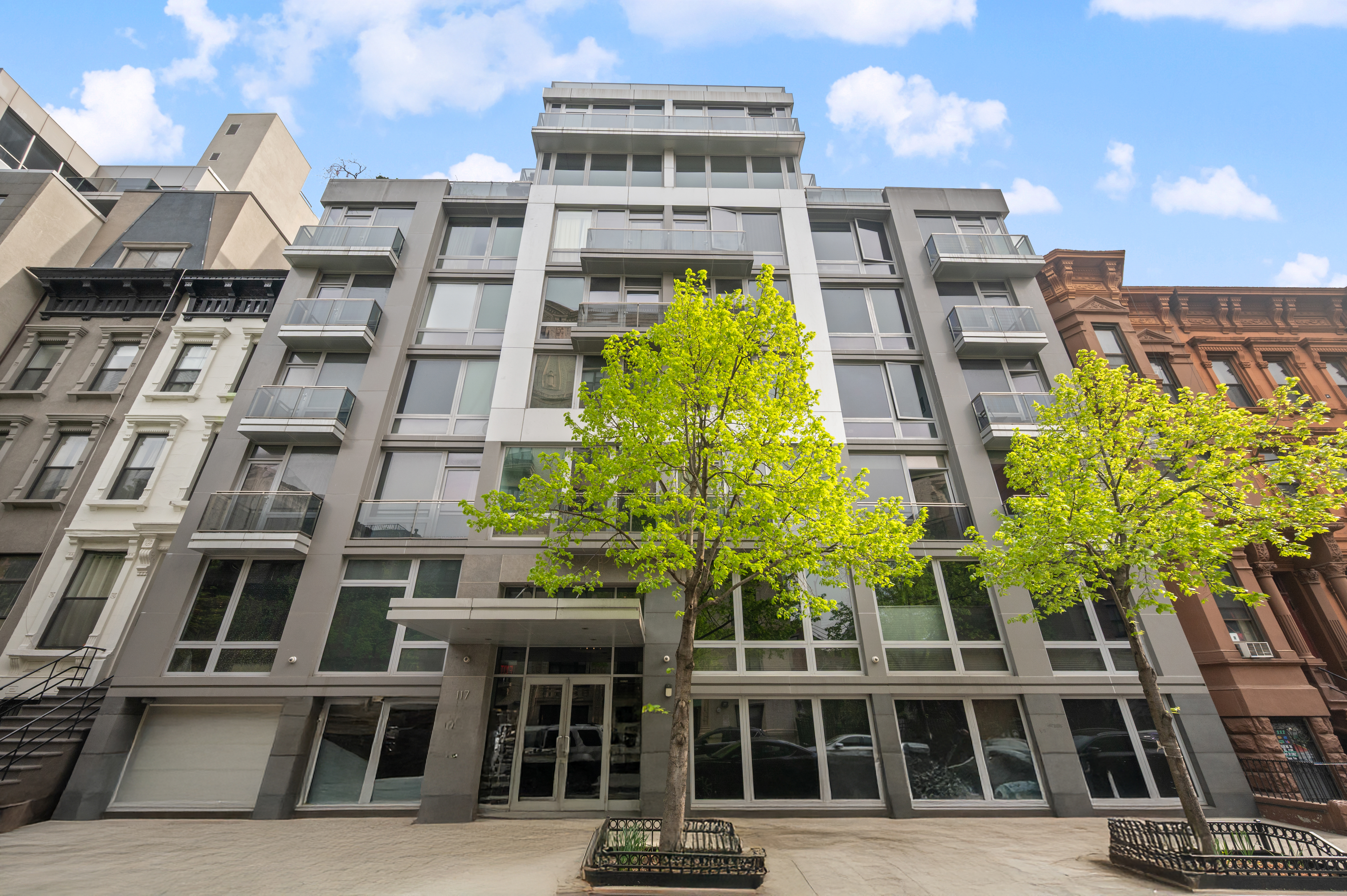 117 West 123rd Street, Unit 5D Manhattan, NY 10027 - Photo 17 of 18 a front view of a multi story building