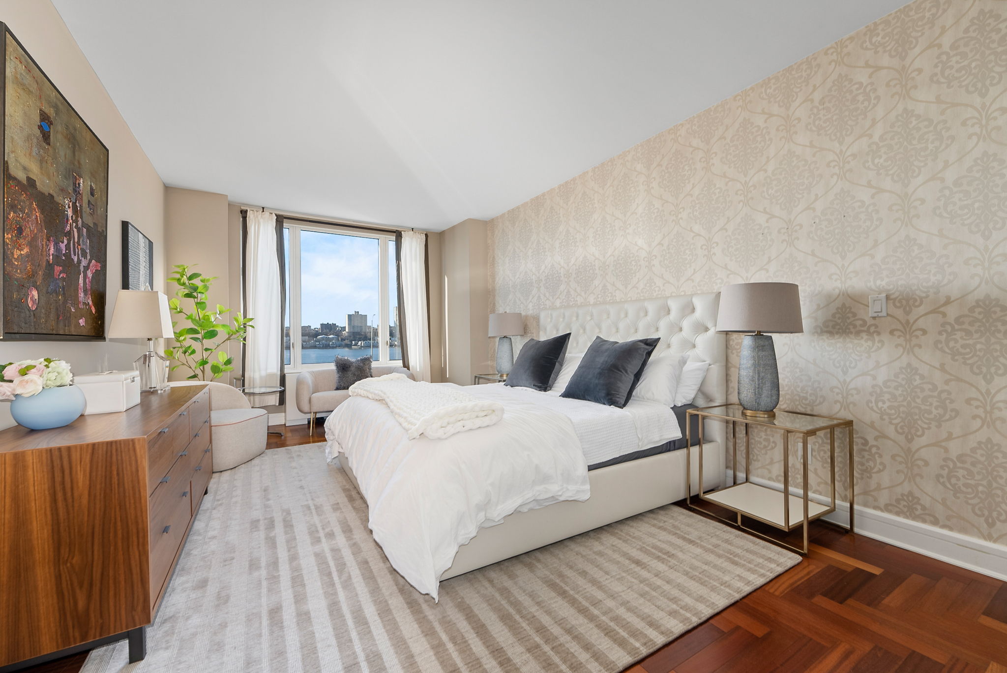 220 Riverside Boulevard, Unit 4M Manhattan, NY 10069 - Photo 6 of 11 a bedroom with a bed wooden floor and window