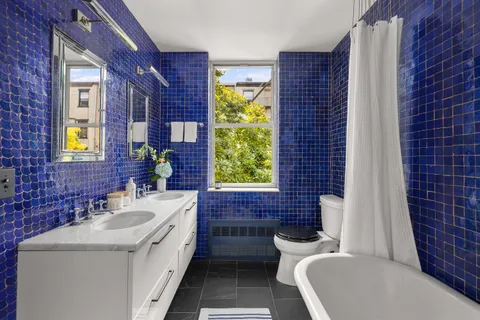 a bathroom with a sink a toilet and a bathtub