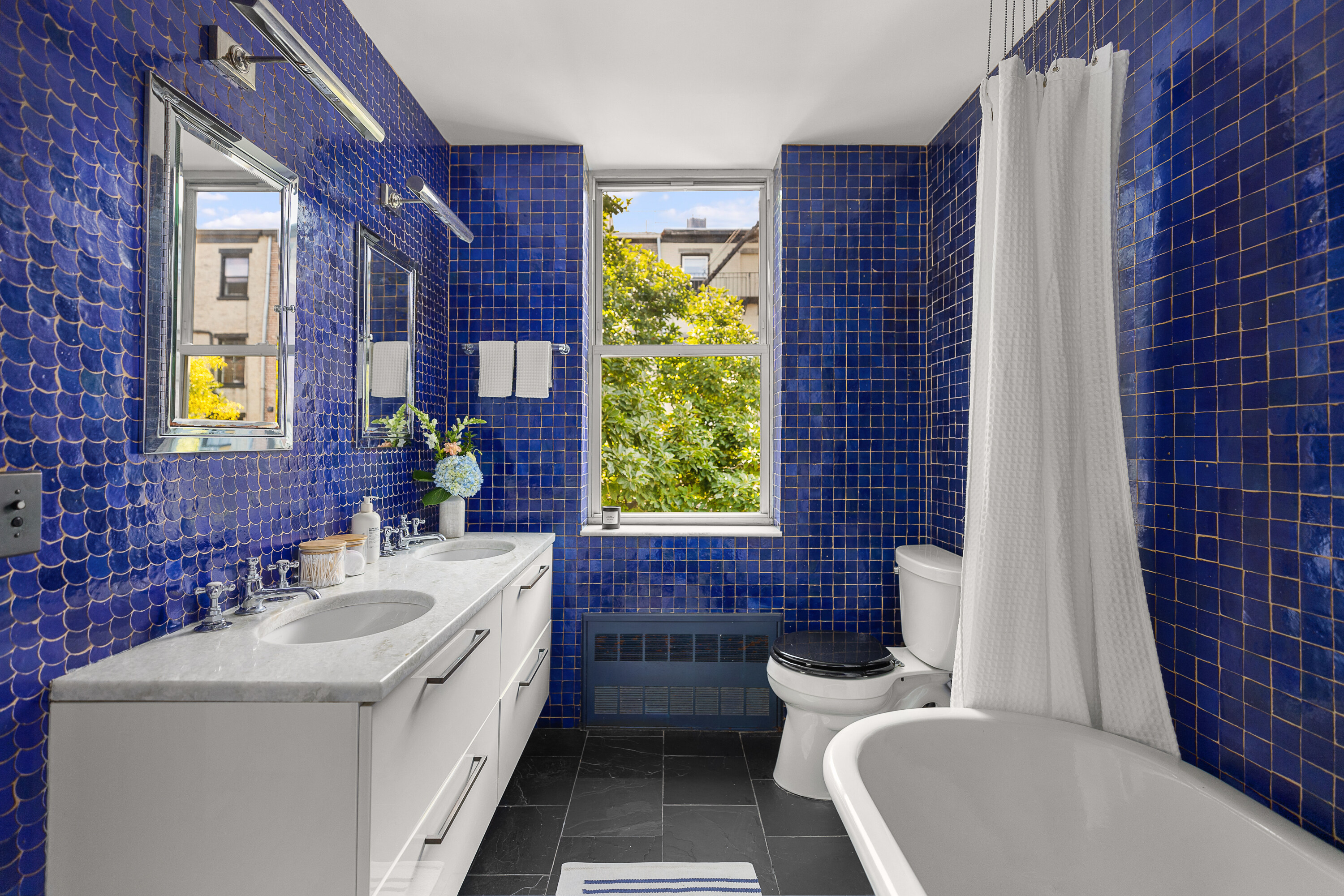 214 Carlton Avenue, Unit 2 Brooklyn, NY 11205 - Photo 8 of 16 a bathroom with a sink a toilet and a bathtub