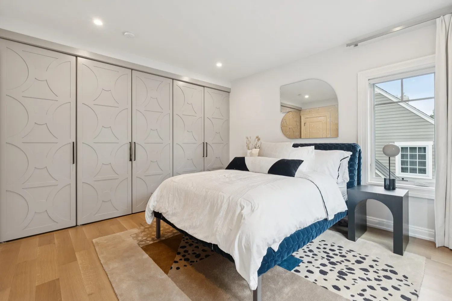 a bedroom with a bed and a table