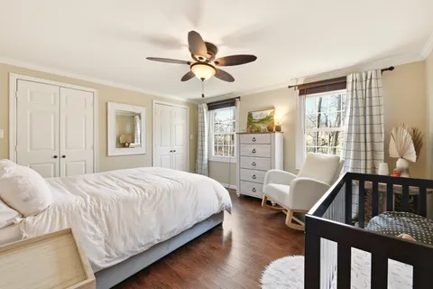 a bedroom with two beds and a couch