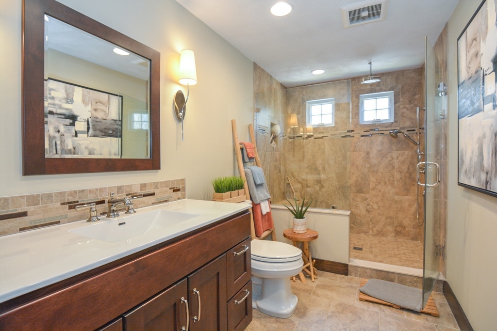 187 Blackstone Street Mendon, MA 01756 - Photo 22 of 42 a bathroom with a toilet sink and mirror