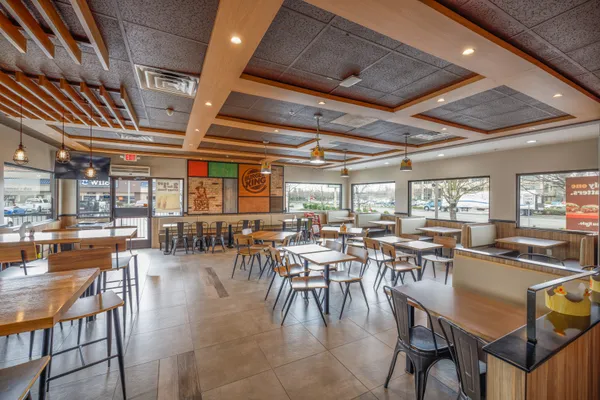 a view of a dining room with furniture window and outside view