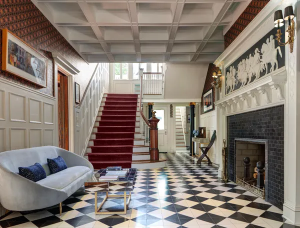 a living room with furniture and a fireplace