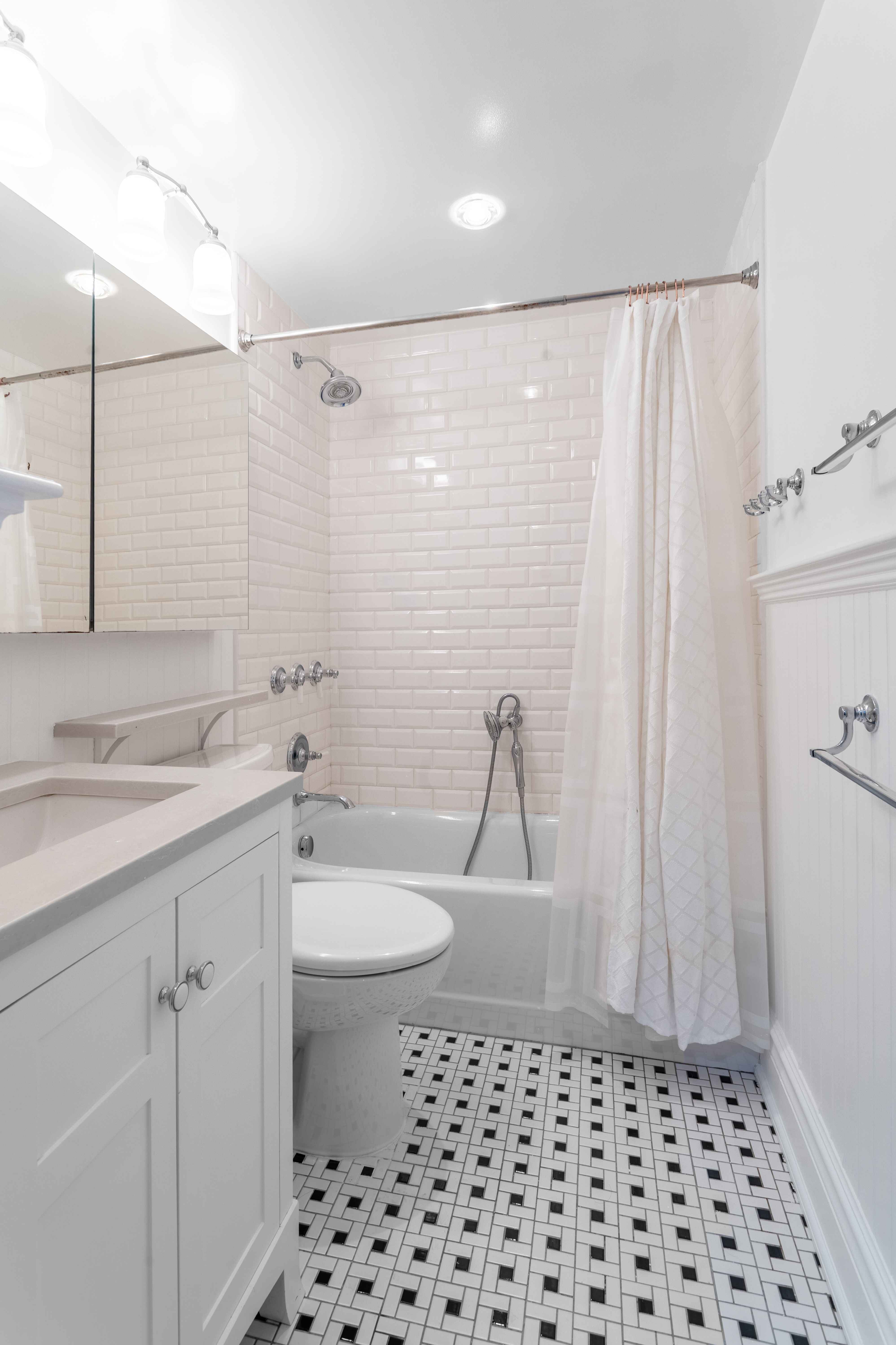 250 West 88th Street, Unit 408 Manhattan, NY 10024 - Photo 3 of 10 a bathroom with a sink a toilet and shower