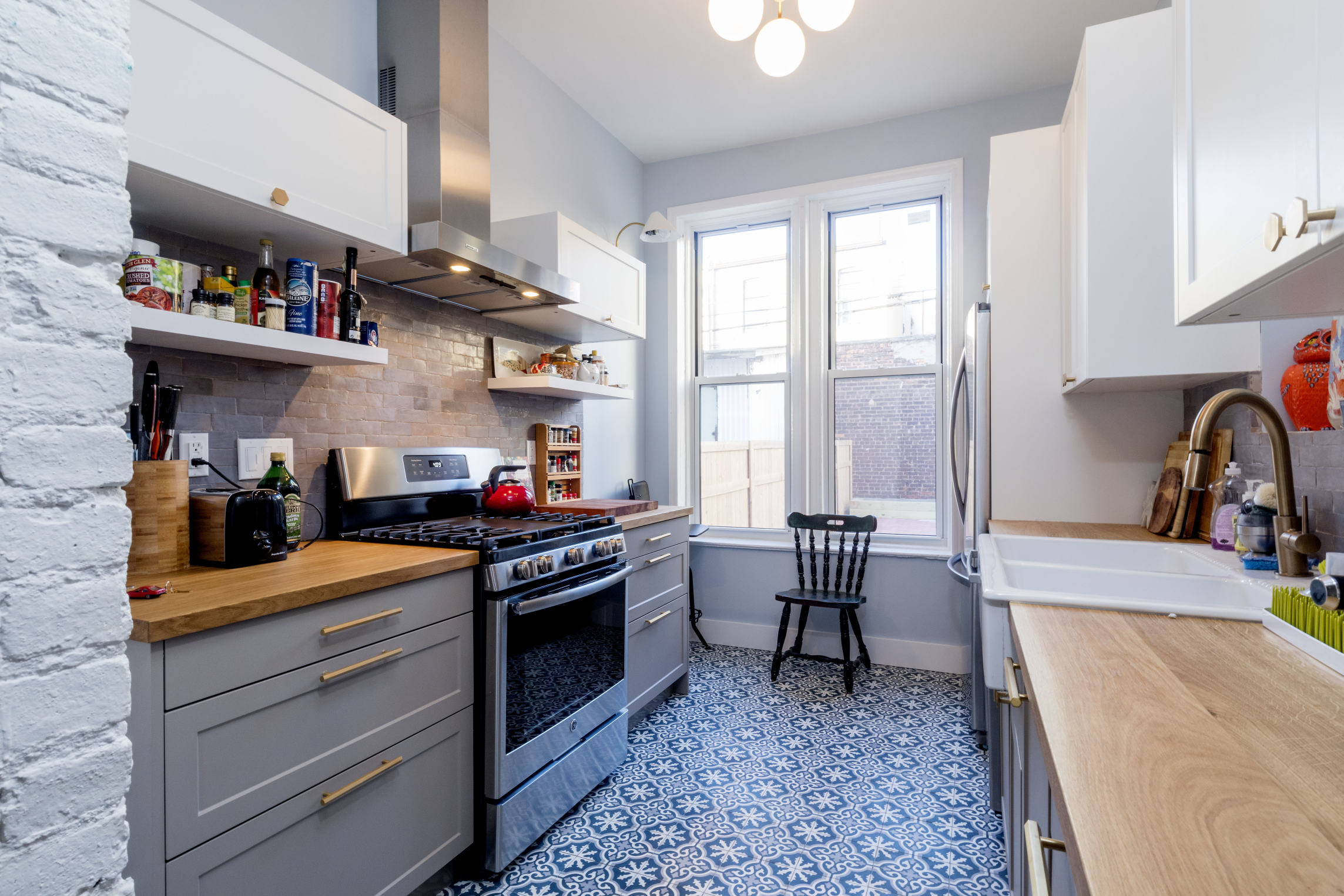 285 Empire Boulevard Brooklyn, NY 11225 - Photo 4 of 18 a kitchen with stainless steel appliances granite countertop a stove a sink and a microwave