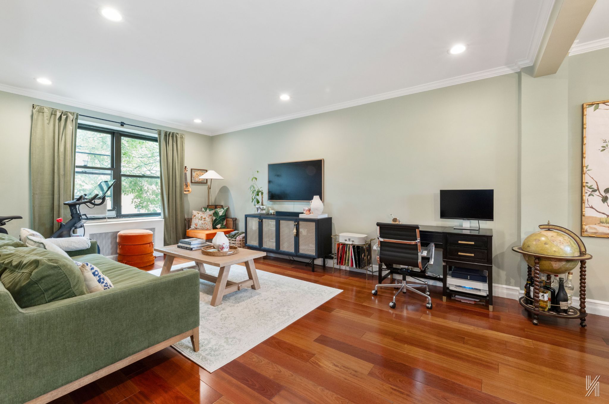 22-31 77th Street, Unit C2 Queens, NY 11370 - Photo 3 of 17 a living room with furniture and a flat screen tv