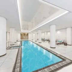 a kitchen with sink refrigerator and cabinets