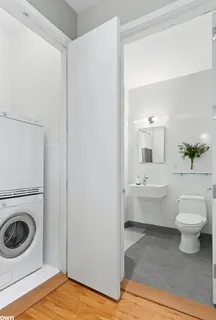 a view of bathroom with toilet sink and mirror