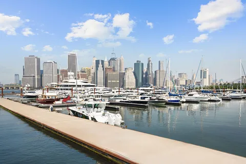 a view of a lake with tall building