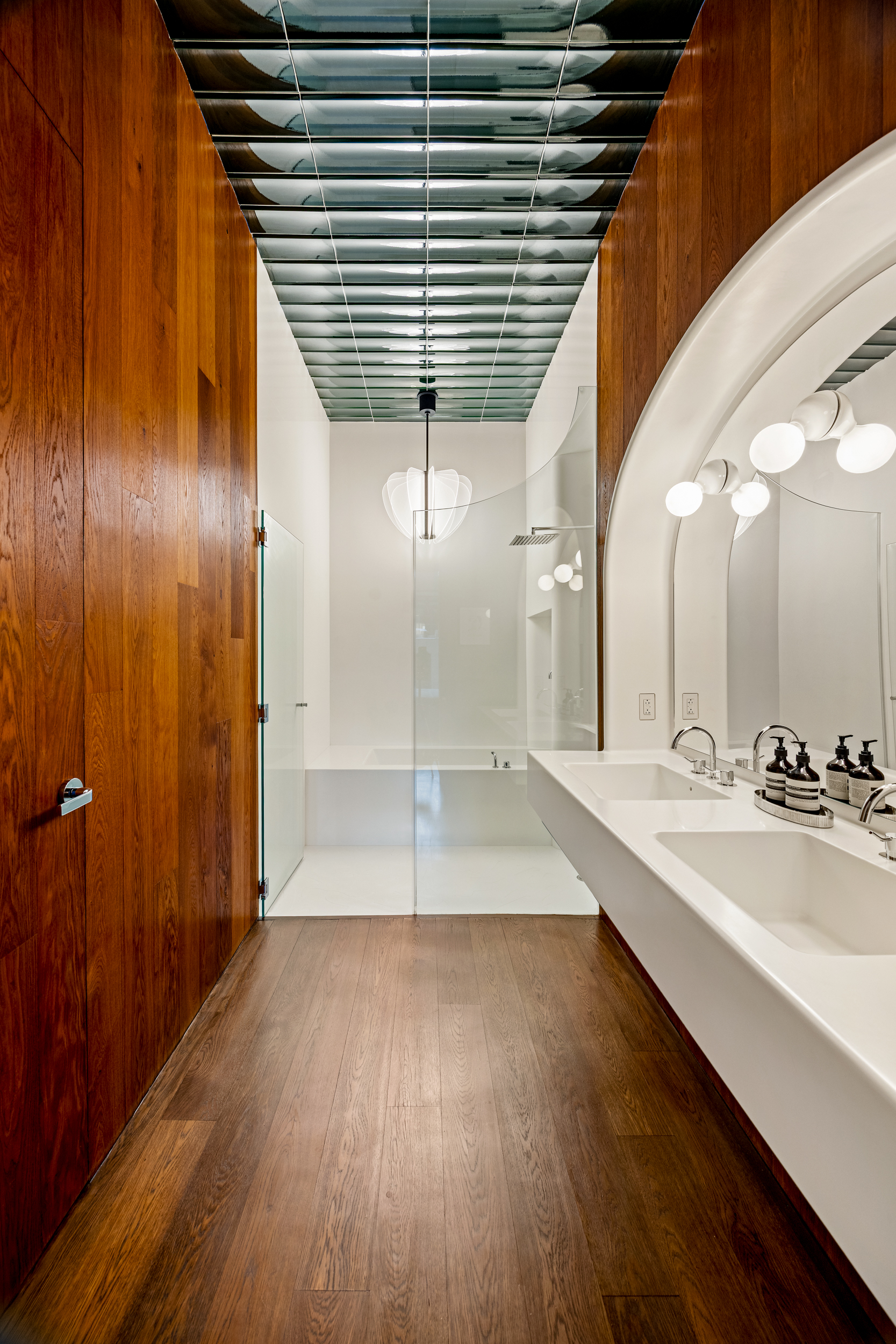 40 Bond Street, Unit 6D Manhattan, NY 10012 - Photo 17 of 23 a bathroom with a sink and a mirror