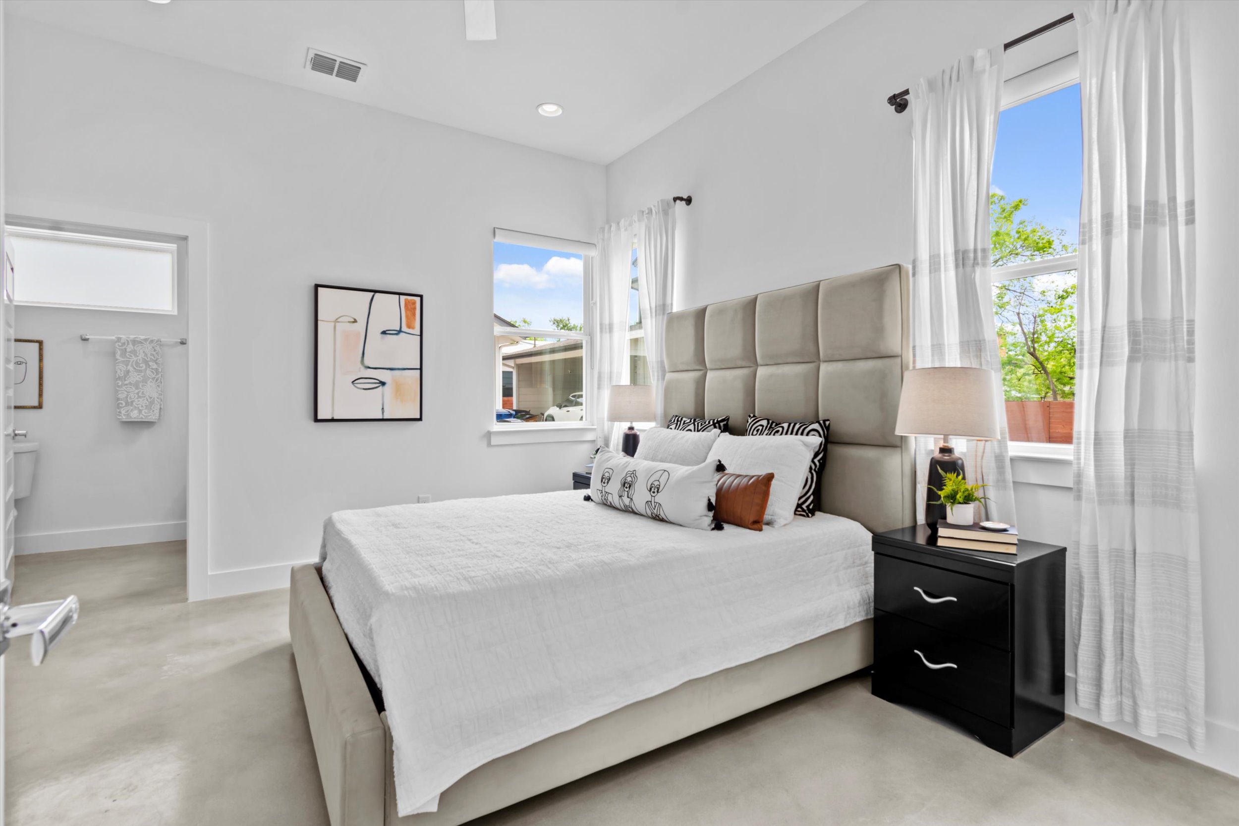 513 West Croslin Street, Unit A Austin, TX 78752 - Photo 16 of 39 a bedroom with a bed and window