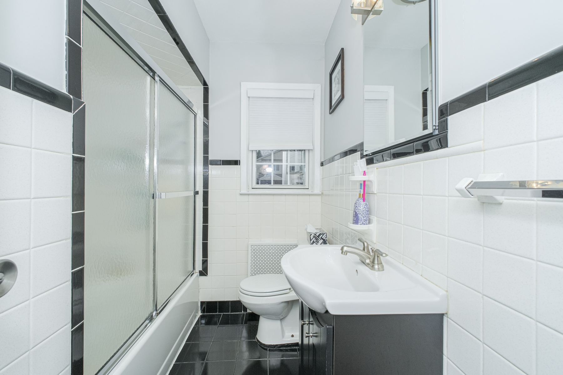 503 Falcon Avenue Staten Island, NY 10306 - Photo 12 of 30 a bathroom with a sink toilet and shower