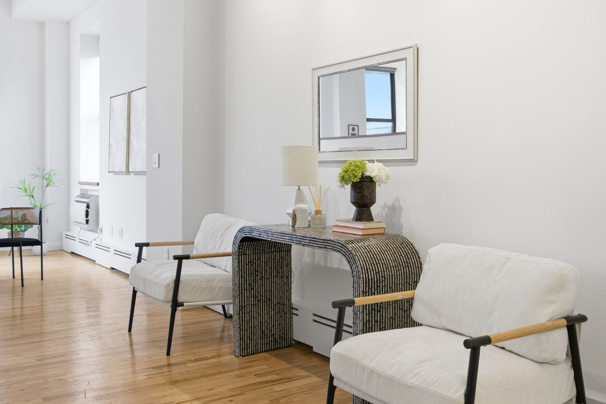 114 East 13th Street, Unit 6B Manhattan, NY 10003 - Photo 4 of 12 a workspace with furniture and wooden floor