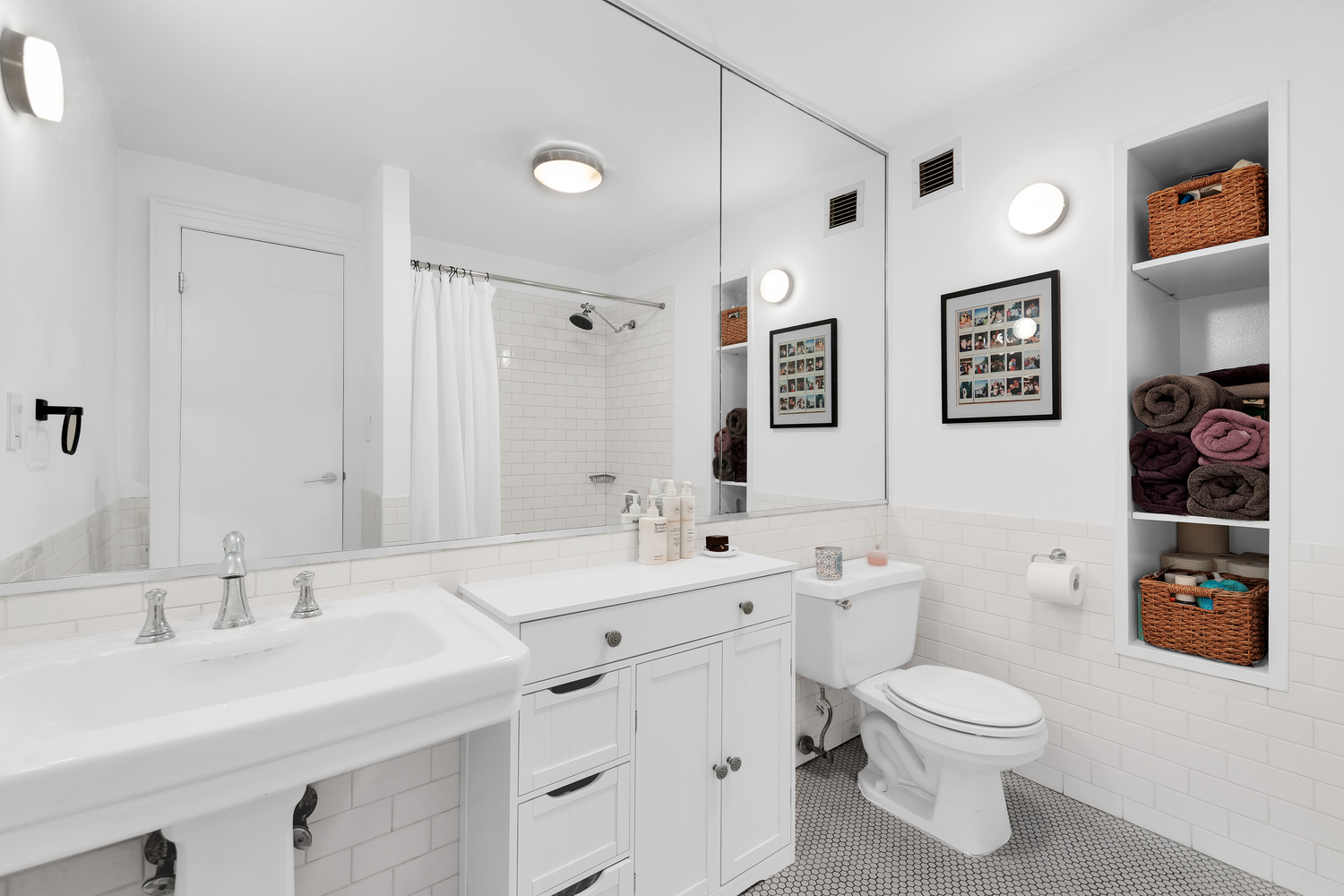 175 East 2nd Street, Unit 4D Manhattan, NY 10009 - Photo 6 of 8 a bathroom with a toilet sink and mirror