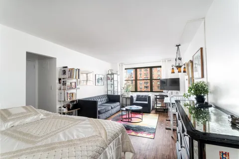 a bedroom with furniture and a bed