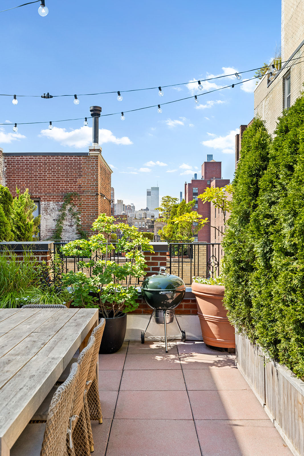 151 East 83rd Street, Unit PHB Manhattan, NY 10028 - Photo 10 of 11 a view of a patio with couches and potted plants