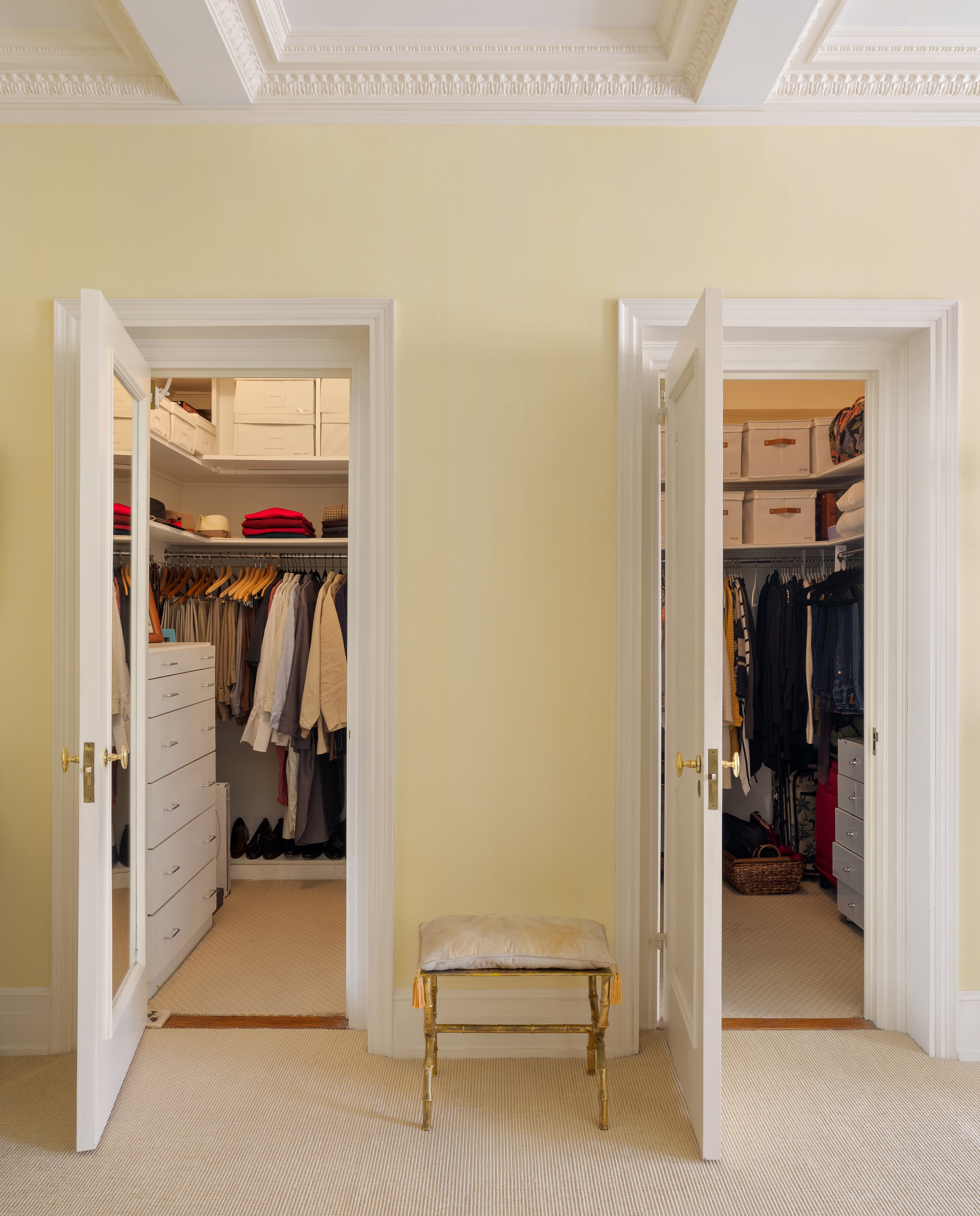 14 East 75th Street, Unit 10C Manhattan, NY 10021 - Photo 7 of 16 a view of walk in closet with clothes and shoes